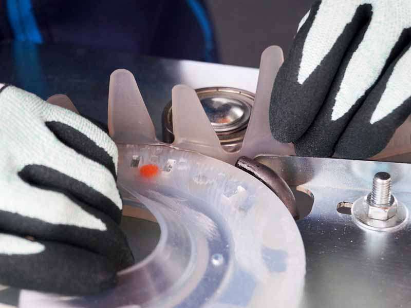 an adhesive collar is bonded to a urethane horse shoe using a welding device.