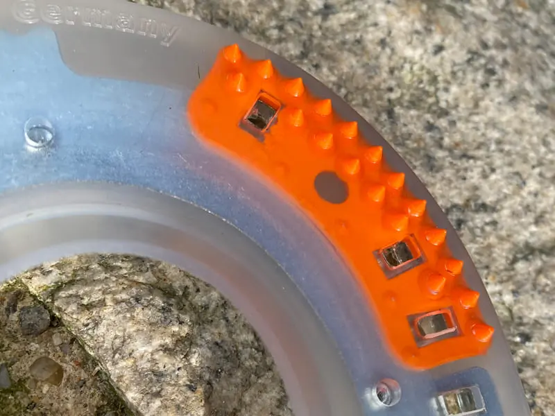 CClose-up of the orange insert in a composite horseshoe – helps keep the un-clipped nail-on horseshoe securely in place