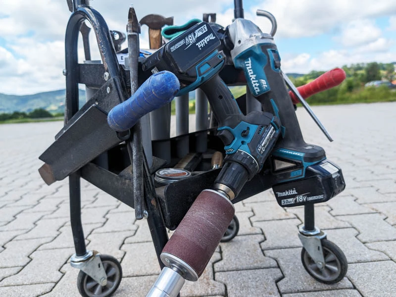 Tool cart of a farrier or hoof care professional with rasps, angle grinder, Hoof Buffer, farrier's hammer, and more.