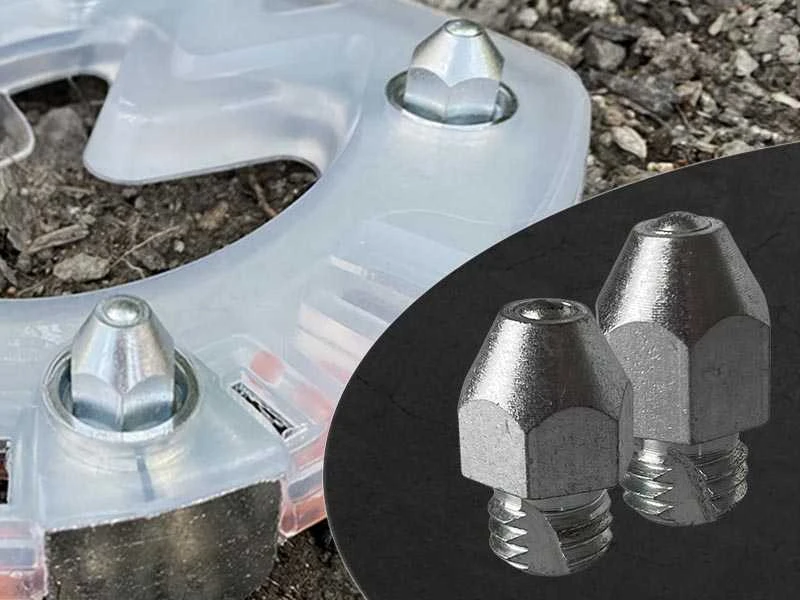 composite horseshoe with ice cleats is lying on stones