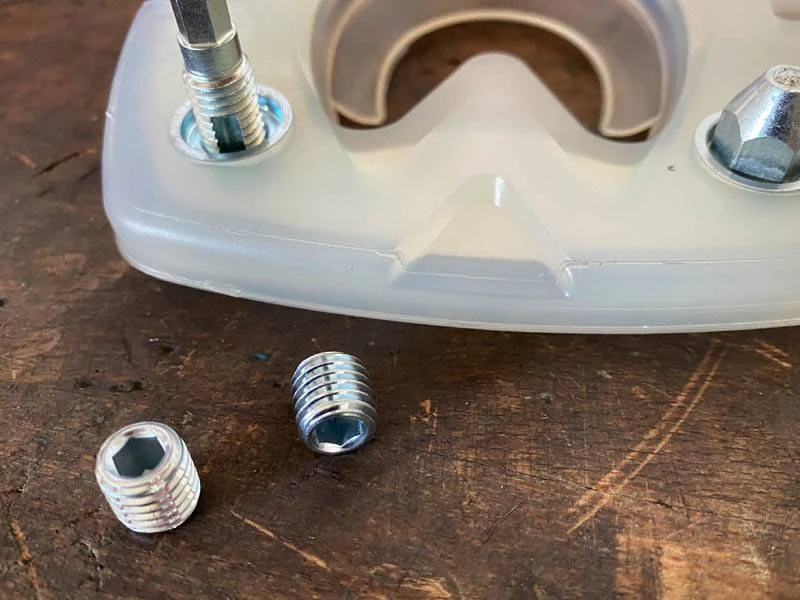 cleaning the stud hole of a composite horseshoe