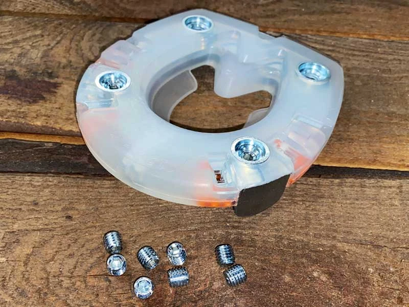 composite horseshoe and suitable metal closing plug to protect the stud holes