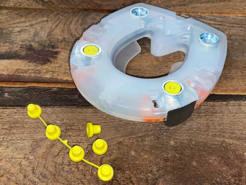 composite horseshoe and suitable plastic closing plug to protect the stud holes