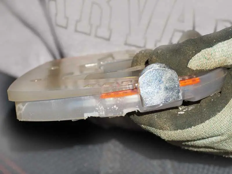 Wedge pad in alternative clipped plastic horseshoe with metal core and side caps