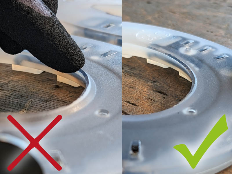 The farrier removes the debris guard from the plastic horseshoe so that the sole protector can be inserted.