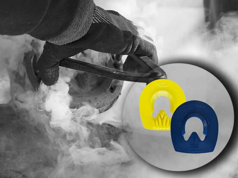 The farrier hot-fits the horseshoe onto the hoof, producing a large amount of smoke. The image also includes a close-up of the blue and yellow hoof pads for horseshoes.
