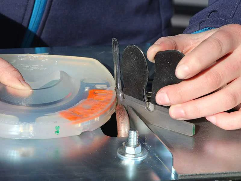 plastic welding glue-on tabs to the composite horseshoe with the welding device