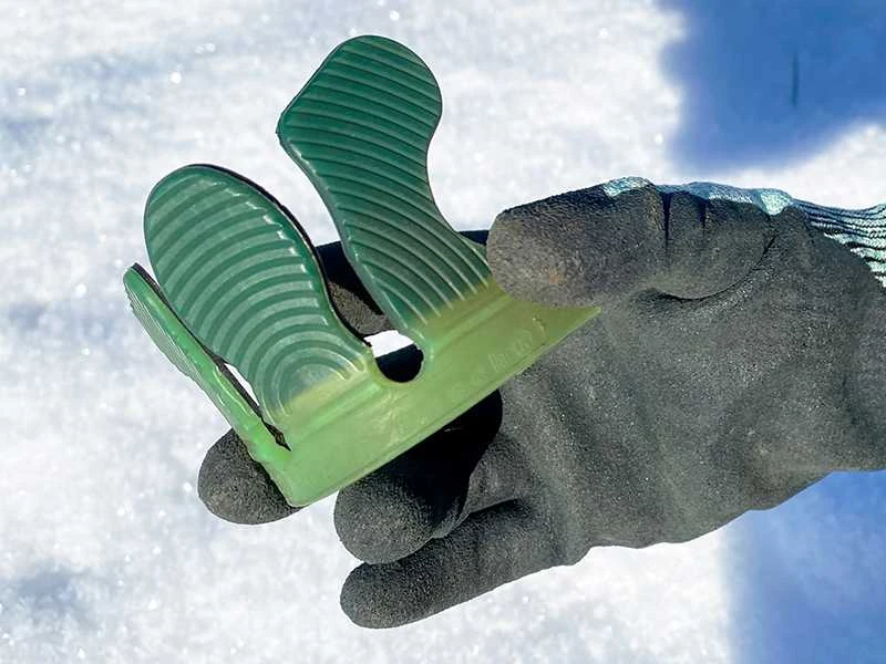 soft version of the Wolf Busch&reg; glue tabs in hand in winter