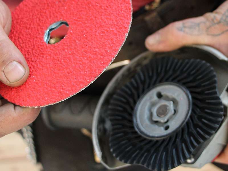 Fiber disc before installation in an angle grinder in which the Pferd Combiclick backing pad is already fitted